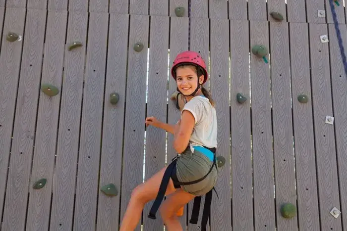 Girl on climbing wall