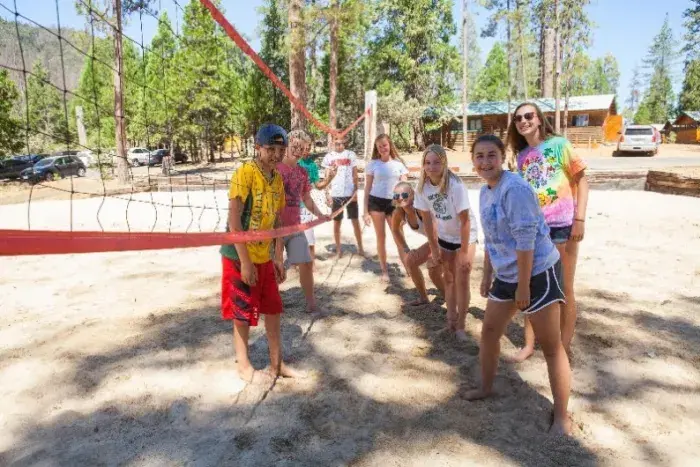 Campers at volleyball net