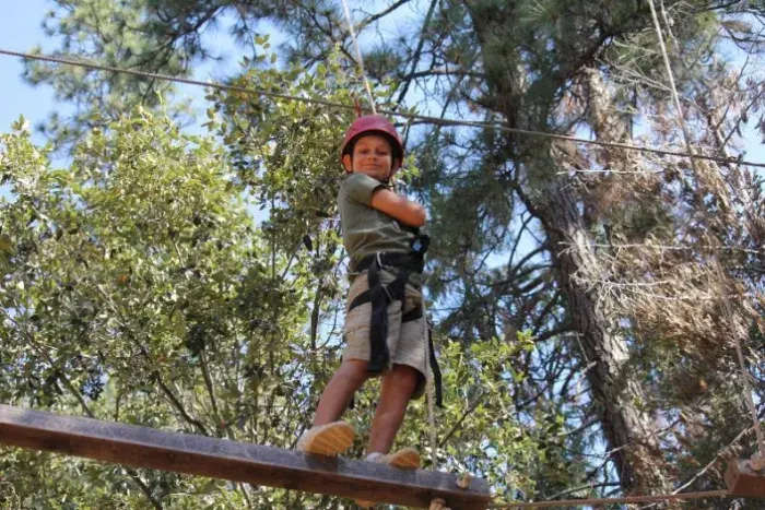 Camper on ropes course